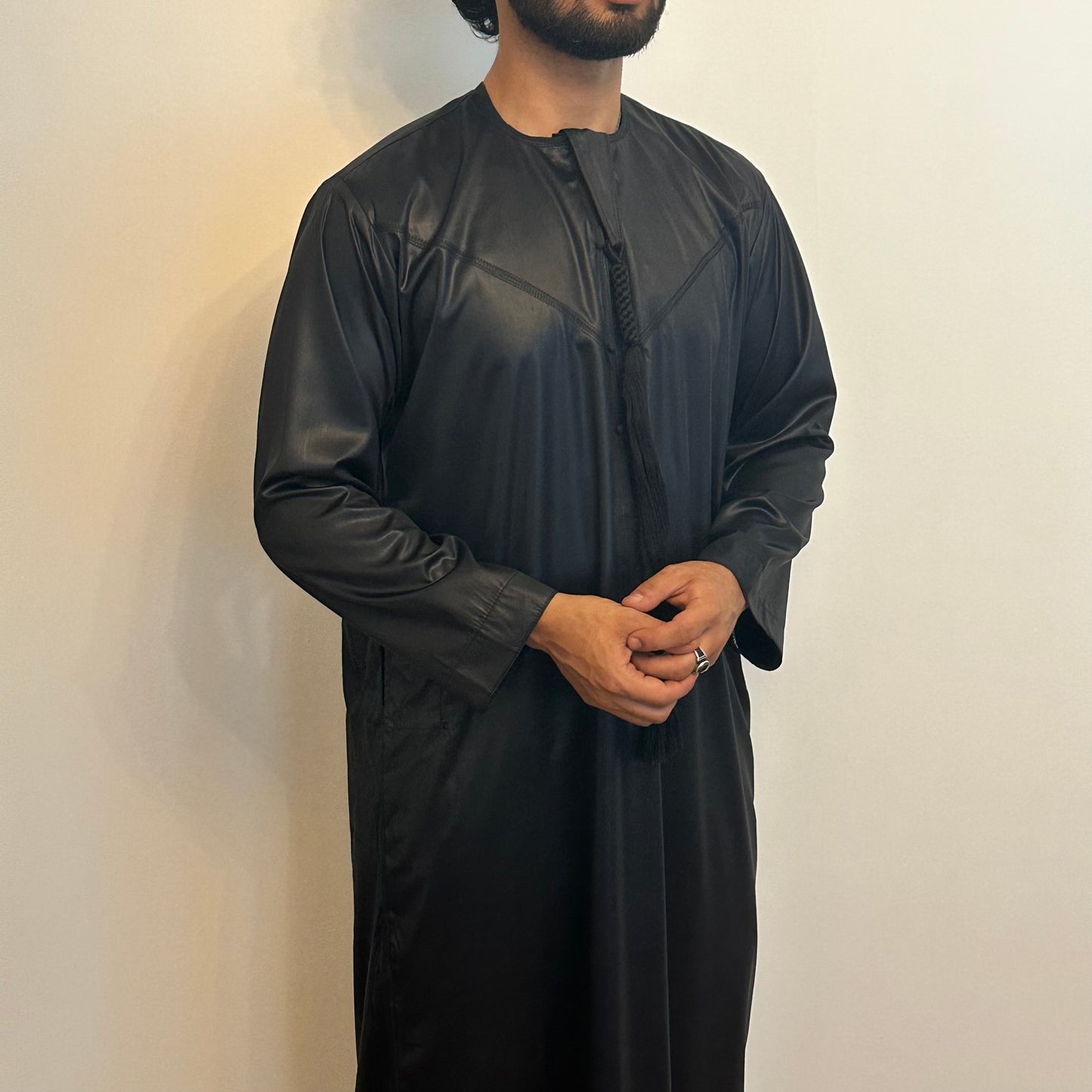 Black silky Emirati thobe with detachable tassel